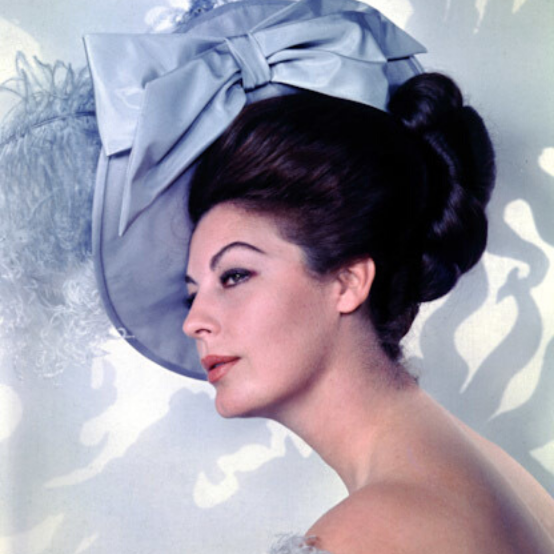 Ava Gardner wearing large blue hat.