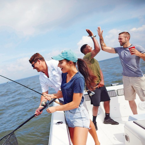 Friends enjoying fishing on a boat in Lake Erie