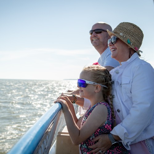 A family enjoying a boat ride in Shores & Islands Ohio