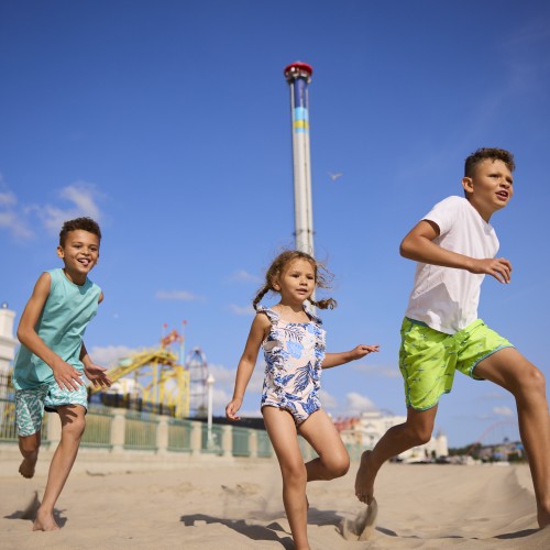 Children running on a Lake Erie beach