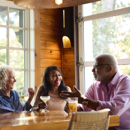 Friends conversing at a table