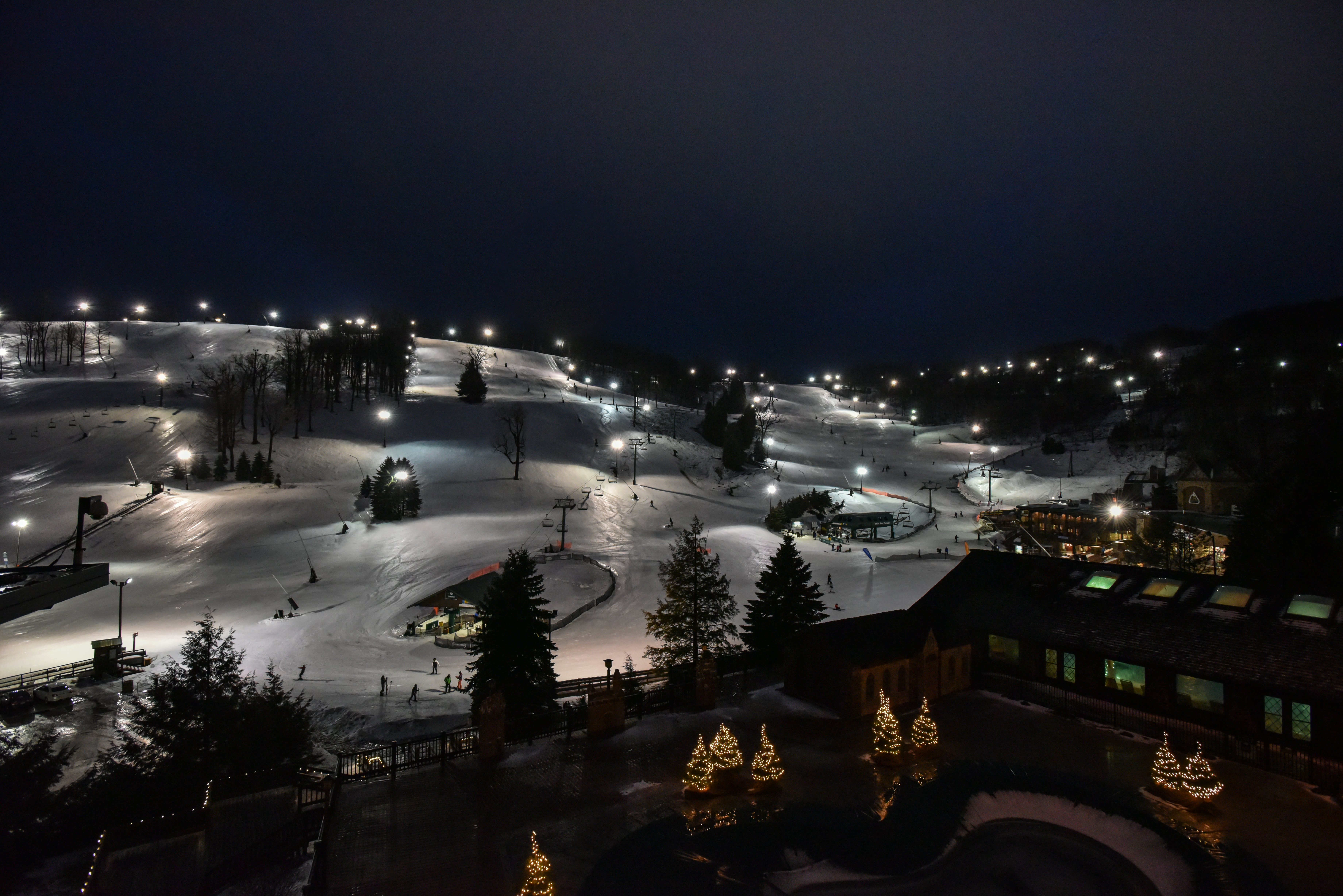 Aerial shot of Seven Springs Resort on a winter night