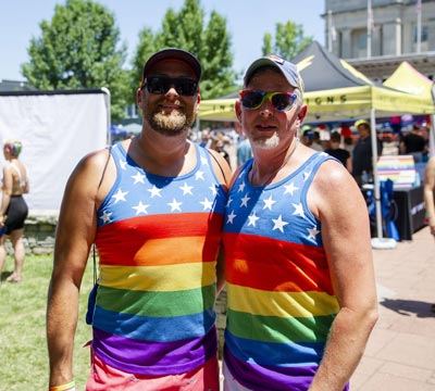 A couple celebrates Pride at the Pride Festival.