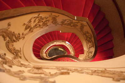 A beautiful staircase leading upstairs in the historic Lexington Opera House.