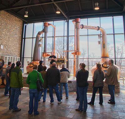 A tour takes place inside the Town Branch Distillery.