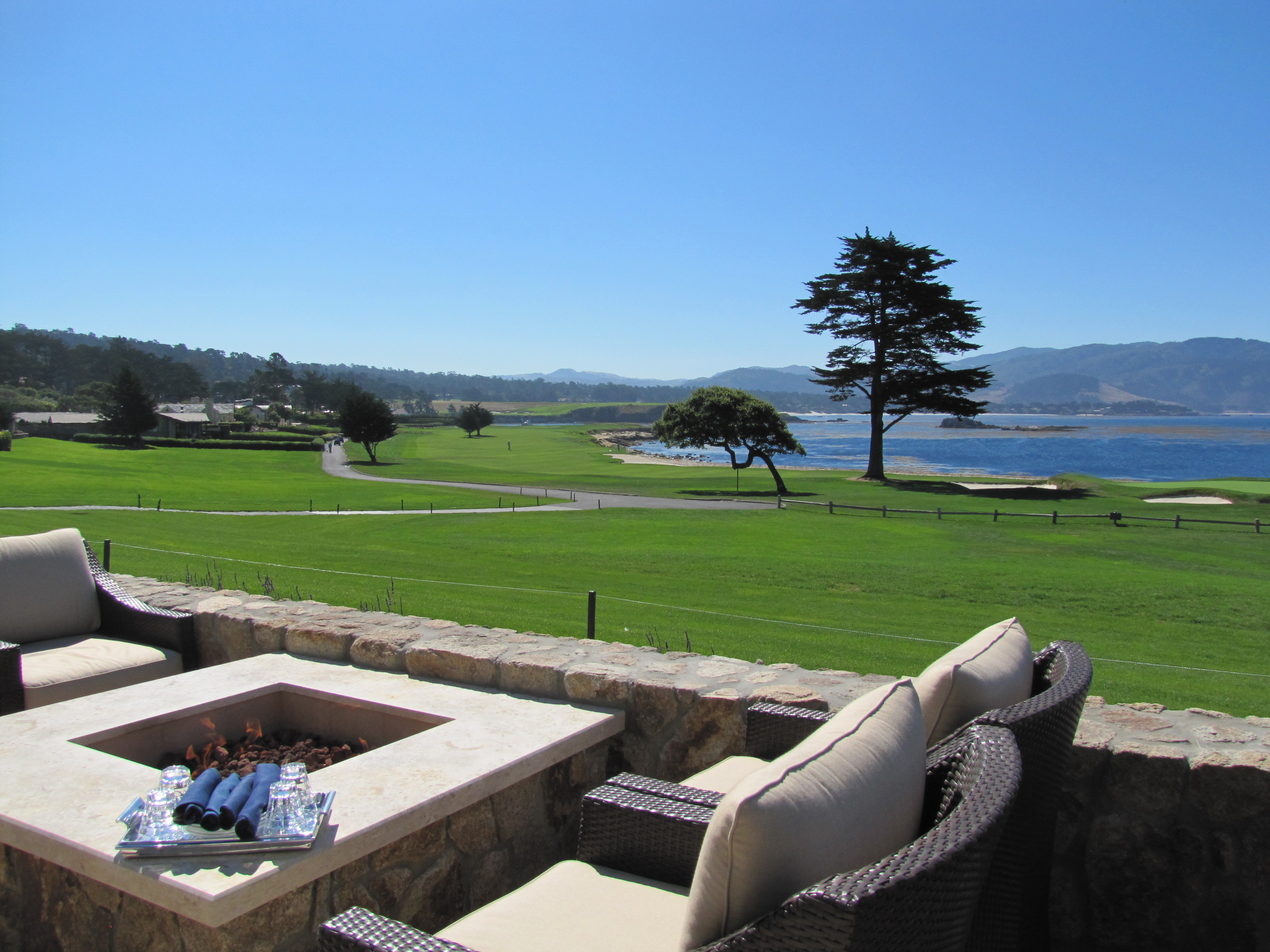 Outdoor seating at The Bench over looking Pebble Beach's golf course
