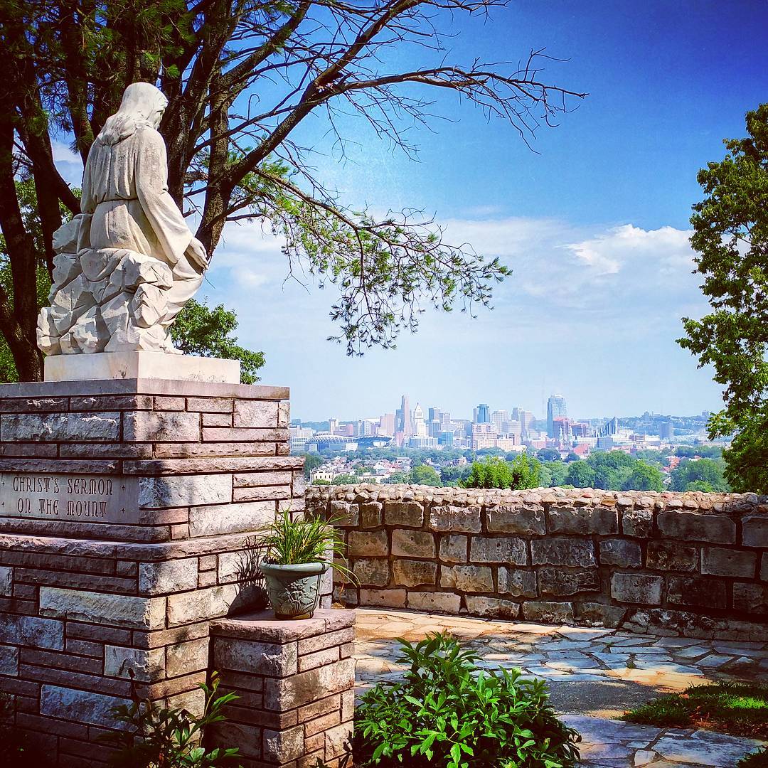 photo of statue at garden of hope in covington ky with views of the cincinnati oh skyline