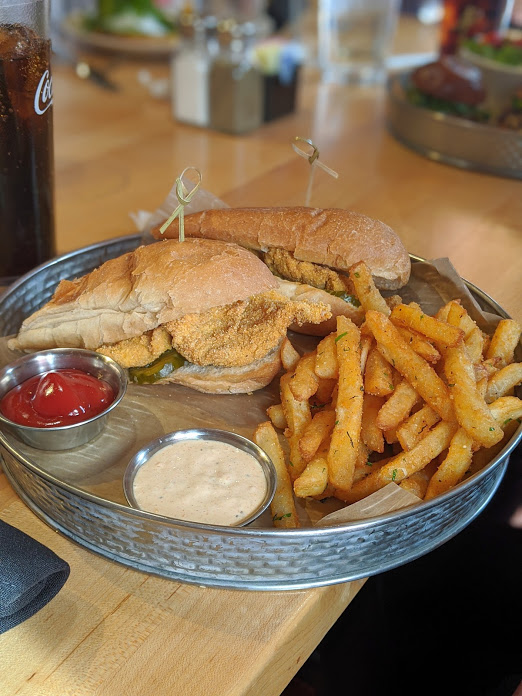photo of catfish poboy and seasoned fries at the kitchen by butler's pantry in covington ky