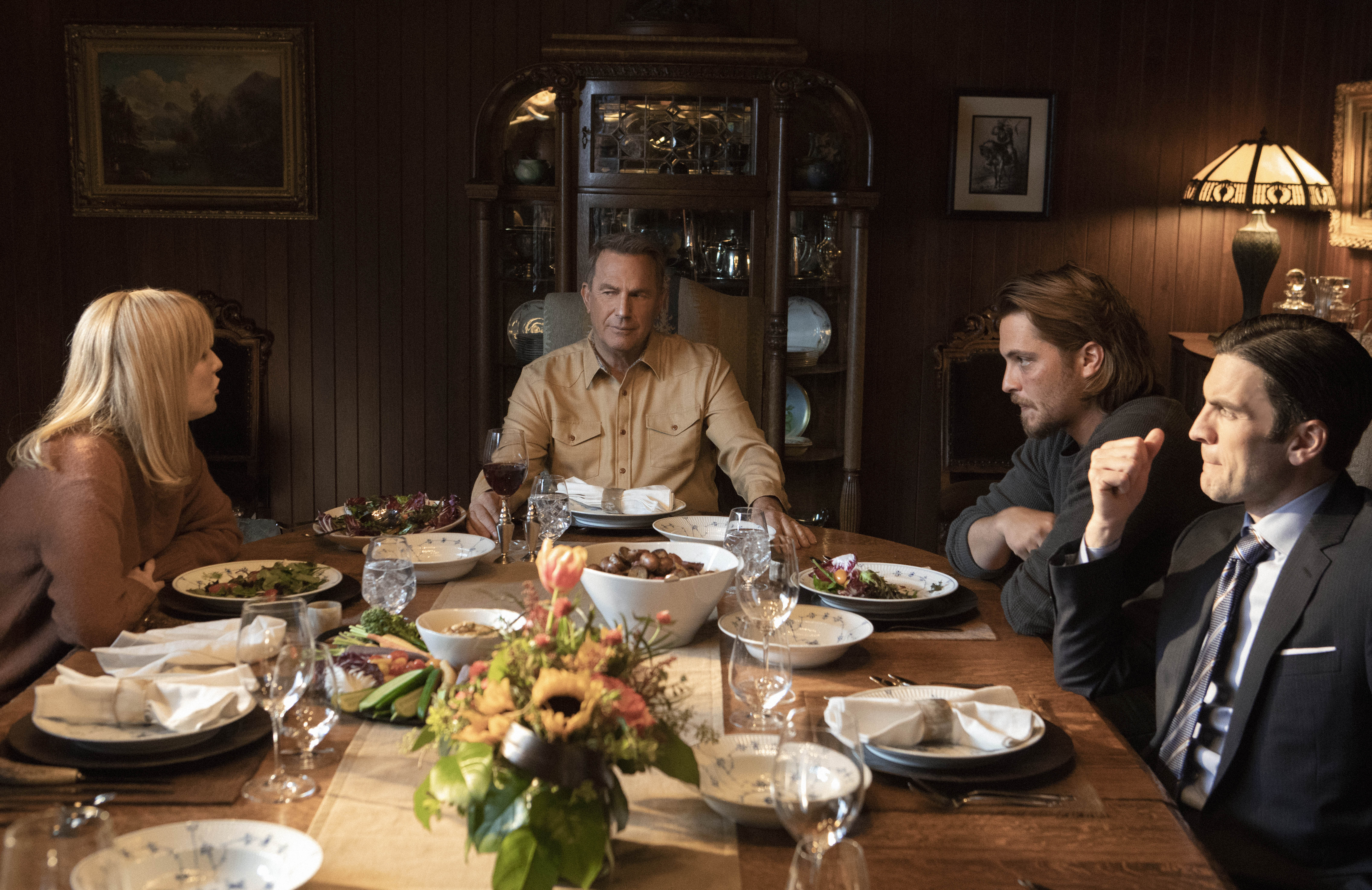 Actors from TV show Yellowstone sitting at dinner table