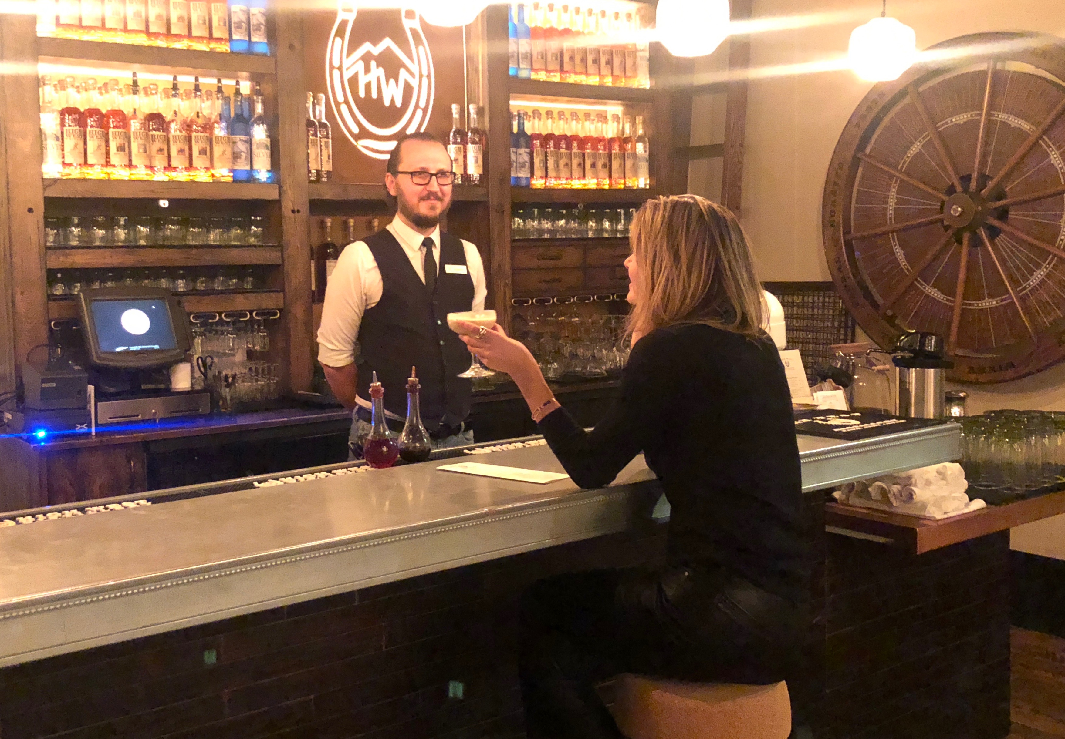 Writer Locke Hughes chats with bartender