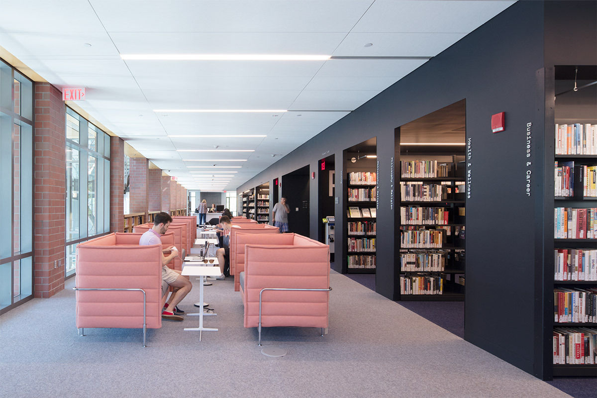 A reading section with pink lounge chairs in the Princeton Public Library
