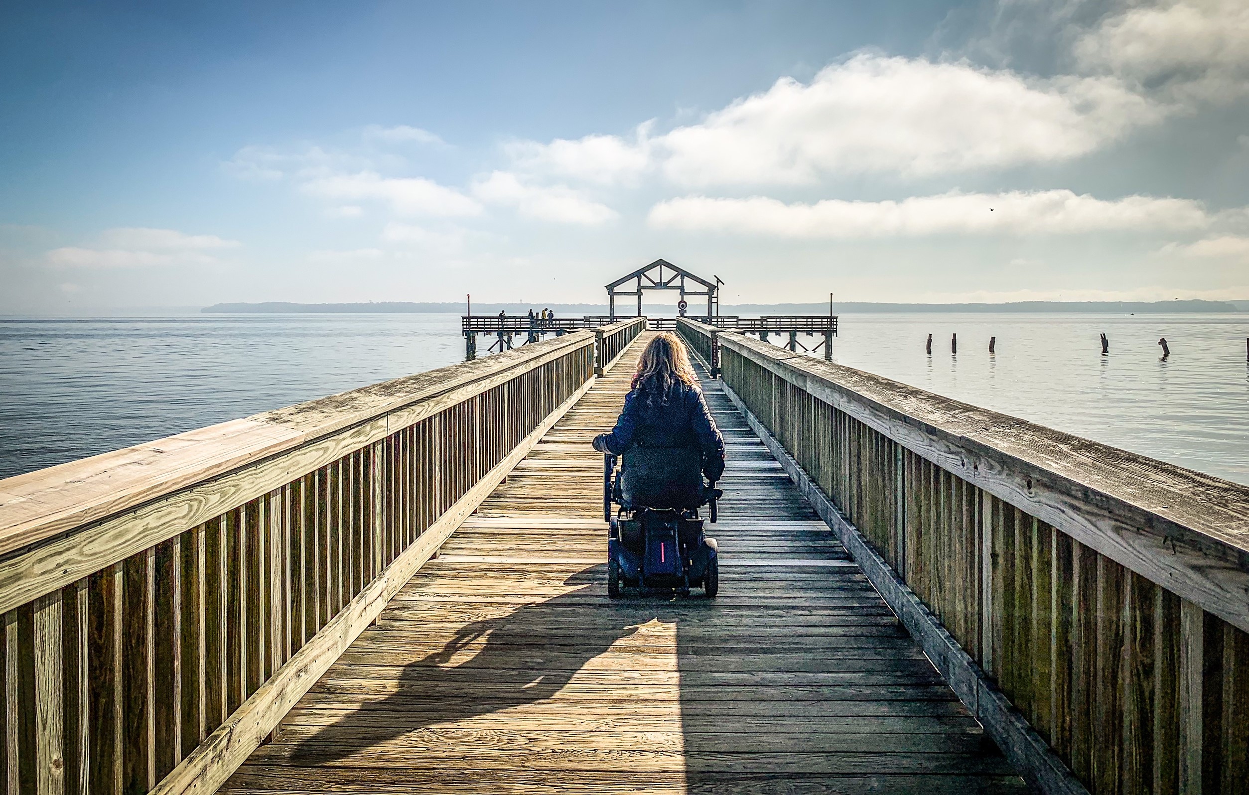 woman in wheelchair on fishing pier at Leesylvania State Park