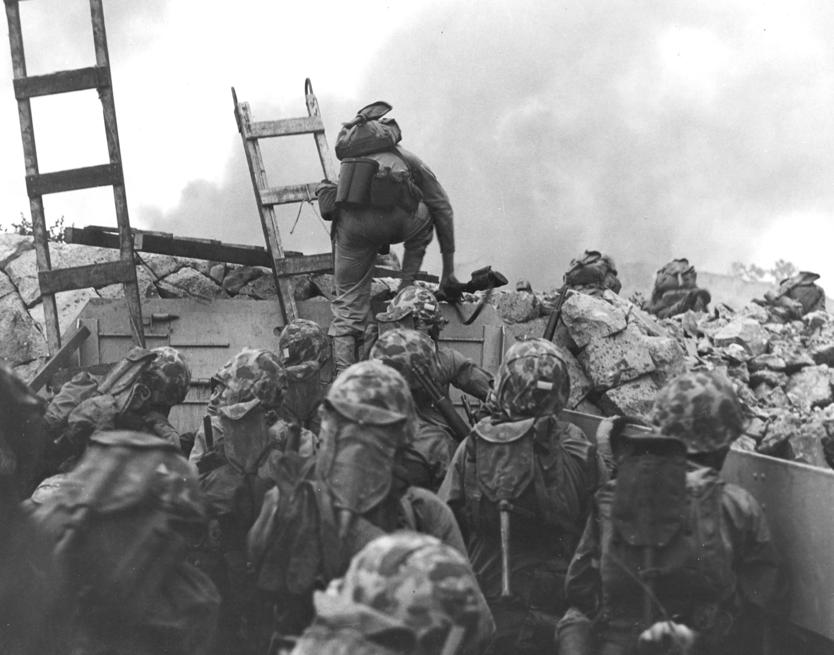 Leathernecks use scaling ladders to storm ashore at Inchon in an amphibious invasion, September 15, 1950