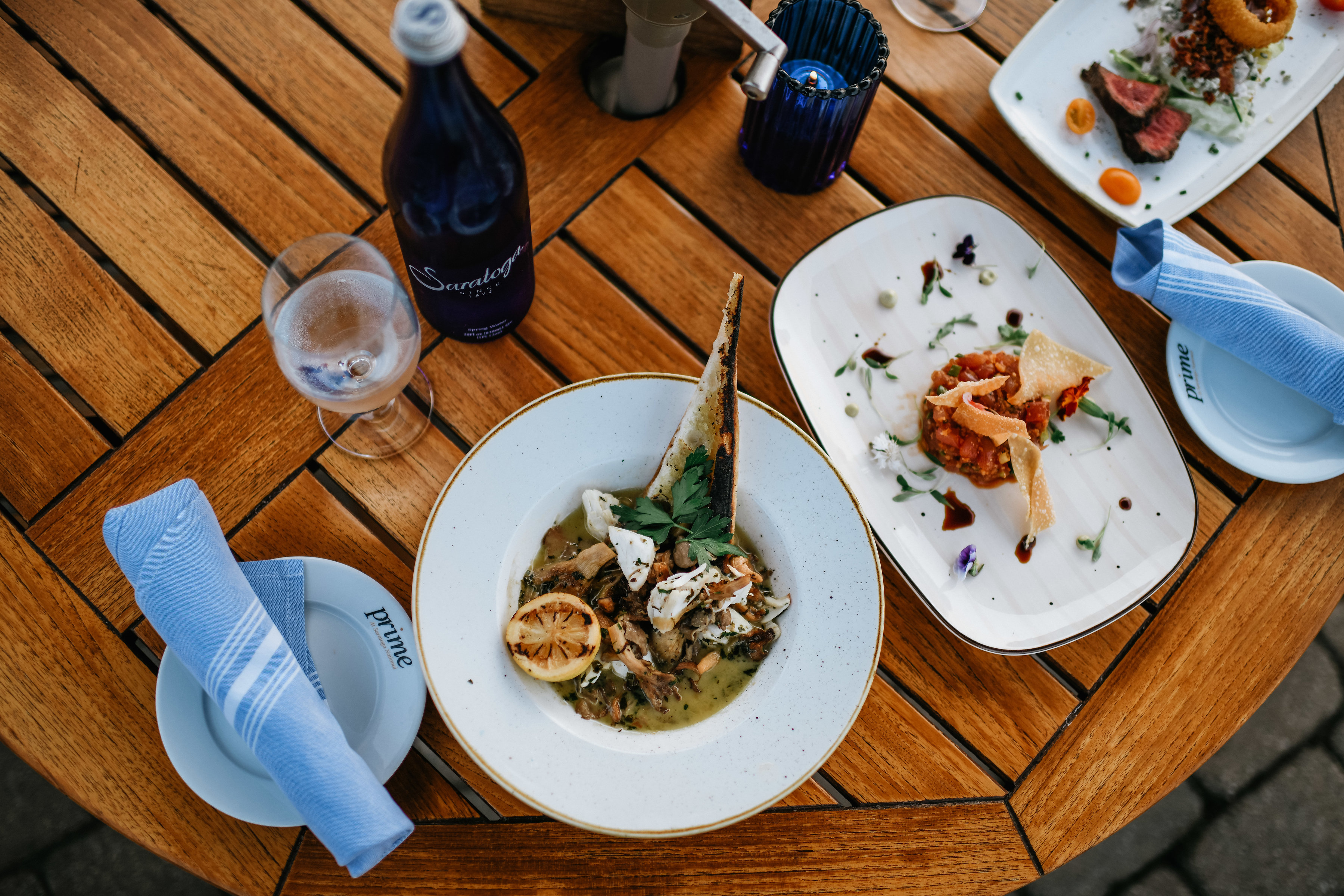 Place setting for dinner on outdoor table at Prime