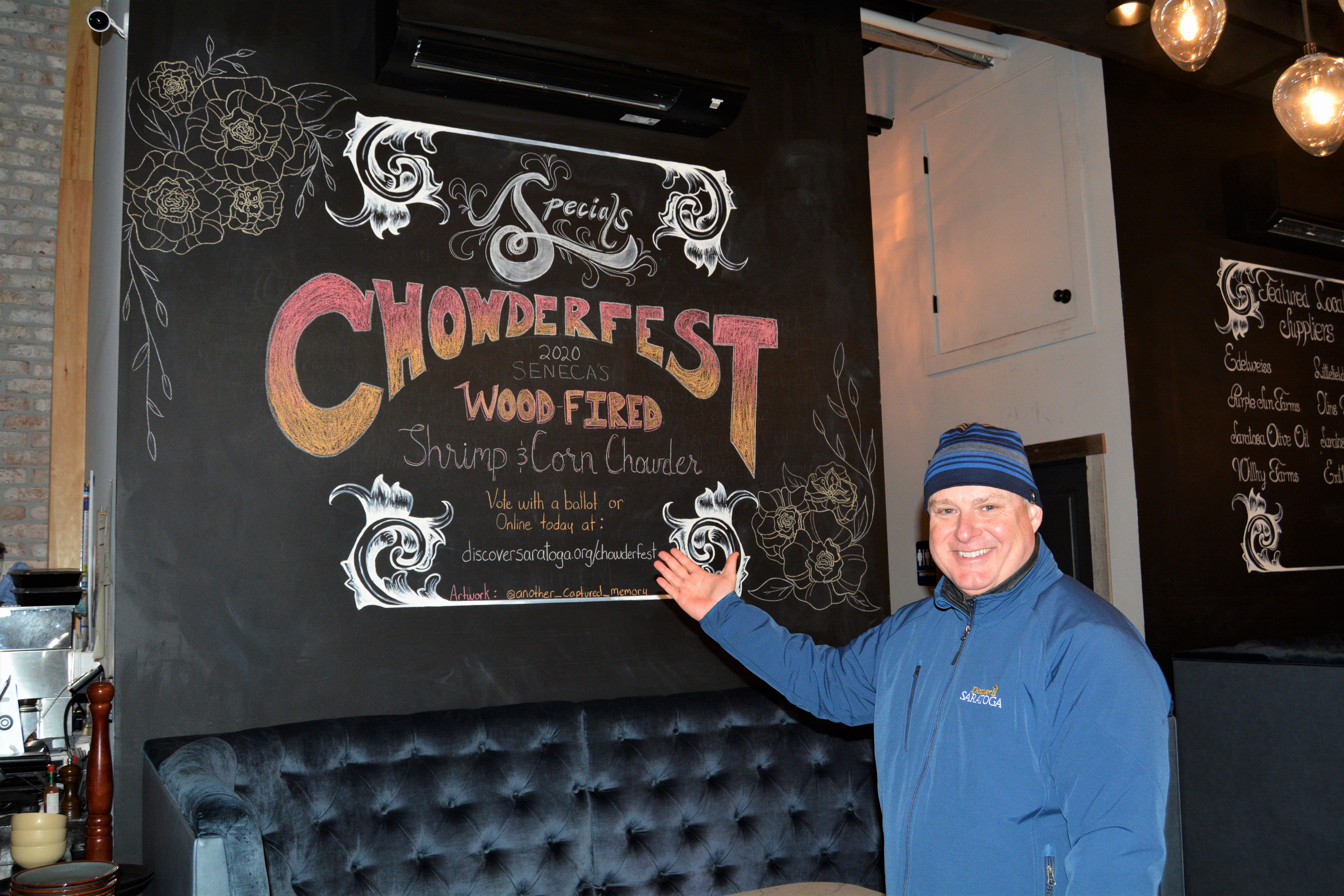 Darryl in front of Chowderfest sign at Seneca