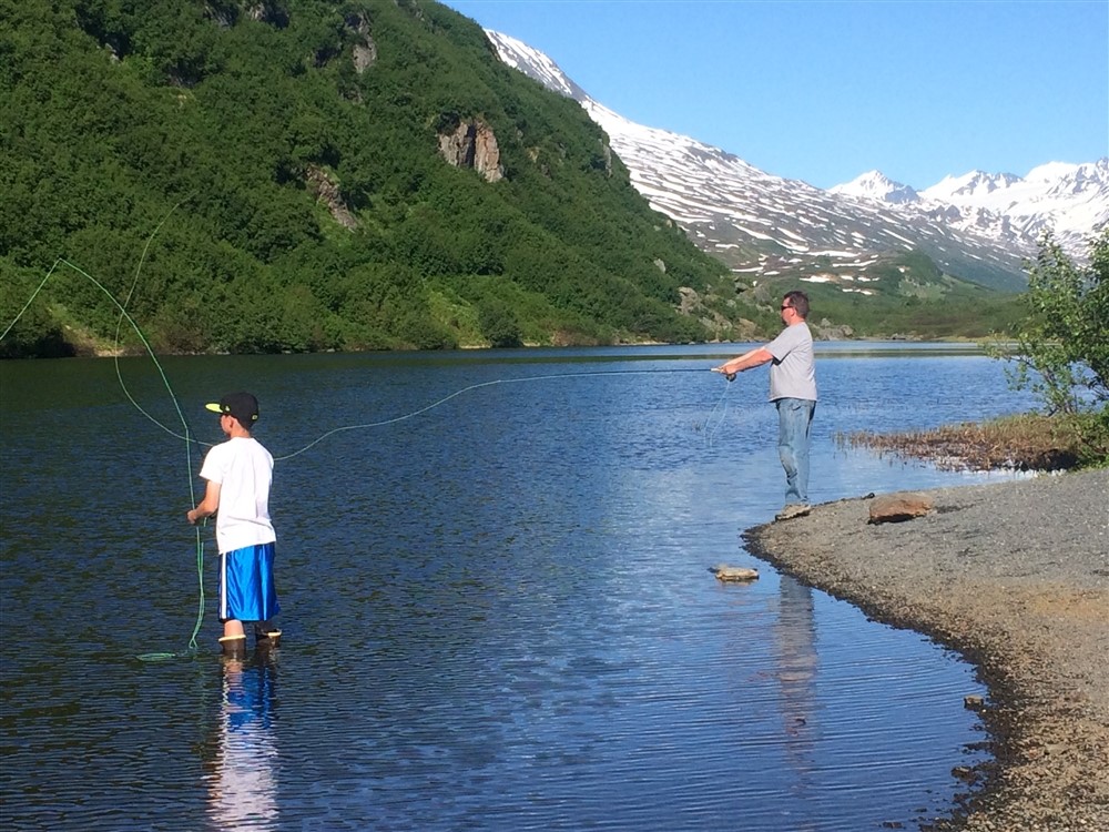 people fishing in a freshwater alpine lake