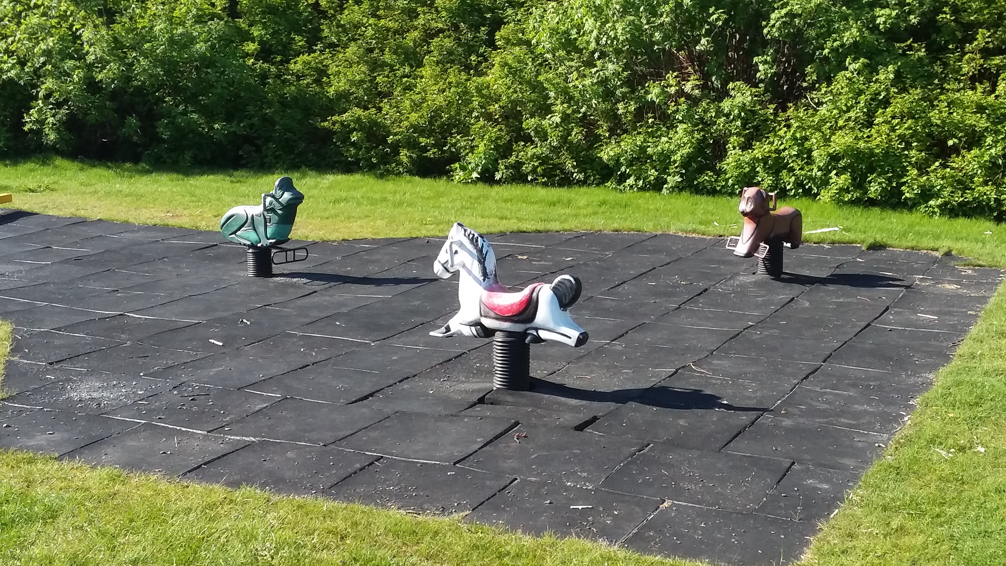 a playground by a pond