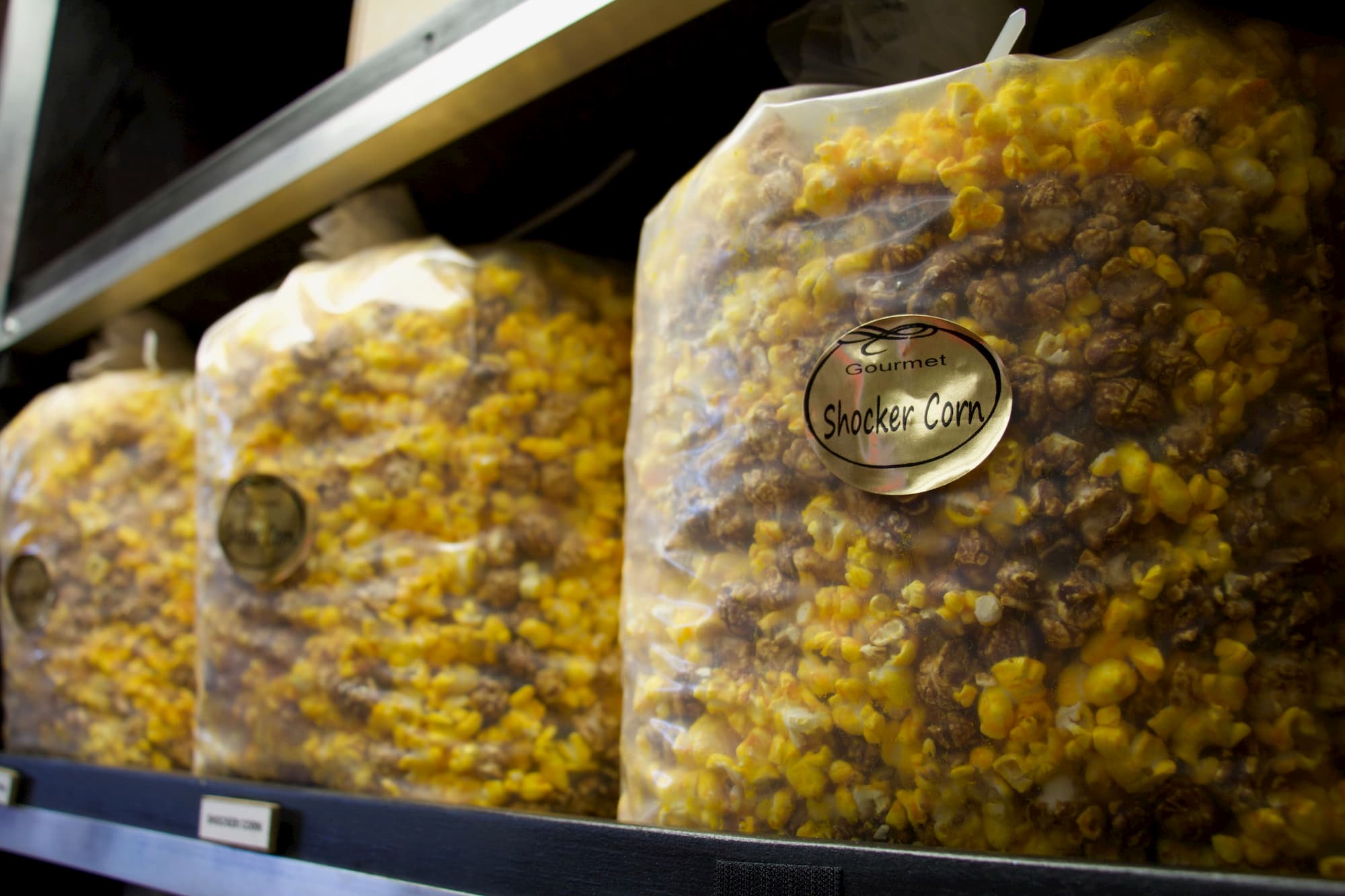 Bags of popcorn sit on shelves at Kernel's Popcorn Express in Wichita