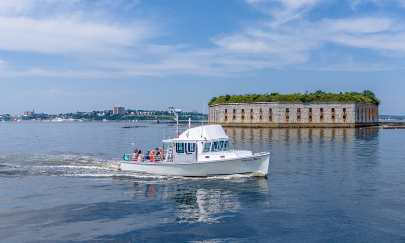 Boat Passing Fort Gorges. Photo Credit: Peter G. Morneau