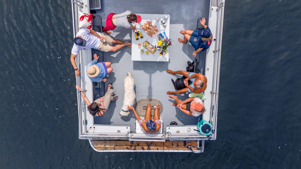 Group having Lobster Rolls on Boat. Photo Credit: Peter G. Morneau
