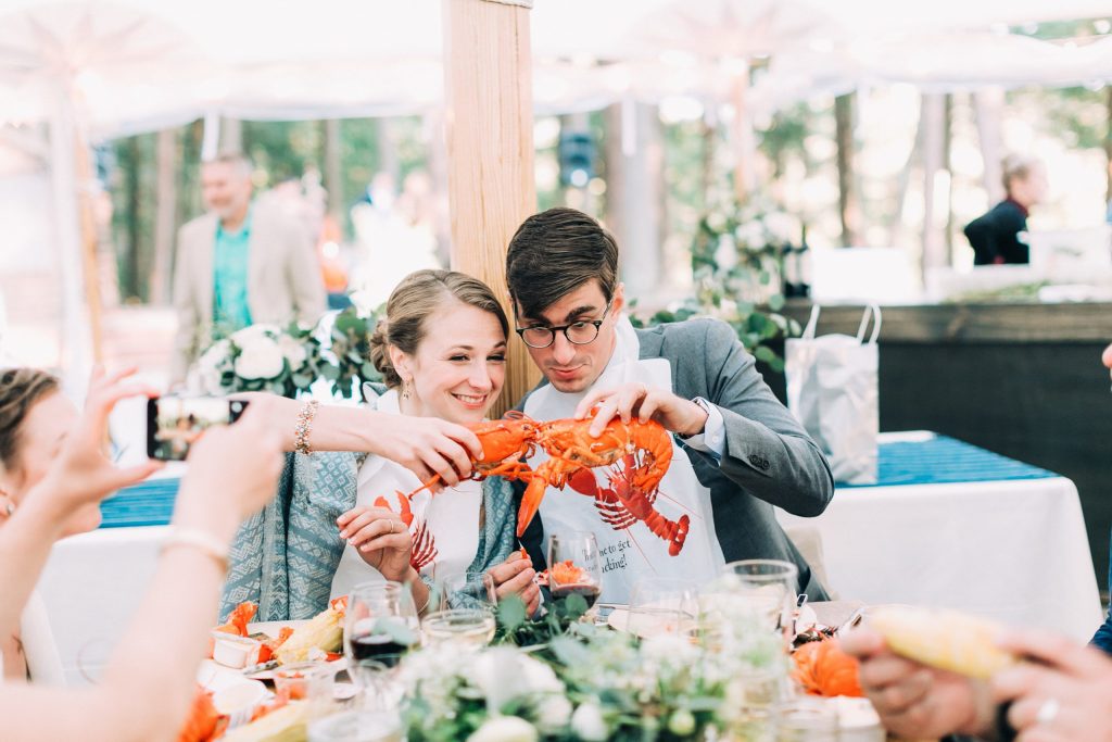 Wedding Couple with Lobster. Photo Provided by The Maine Lobsterbake Co.