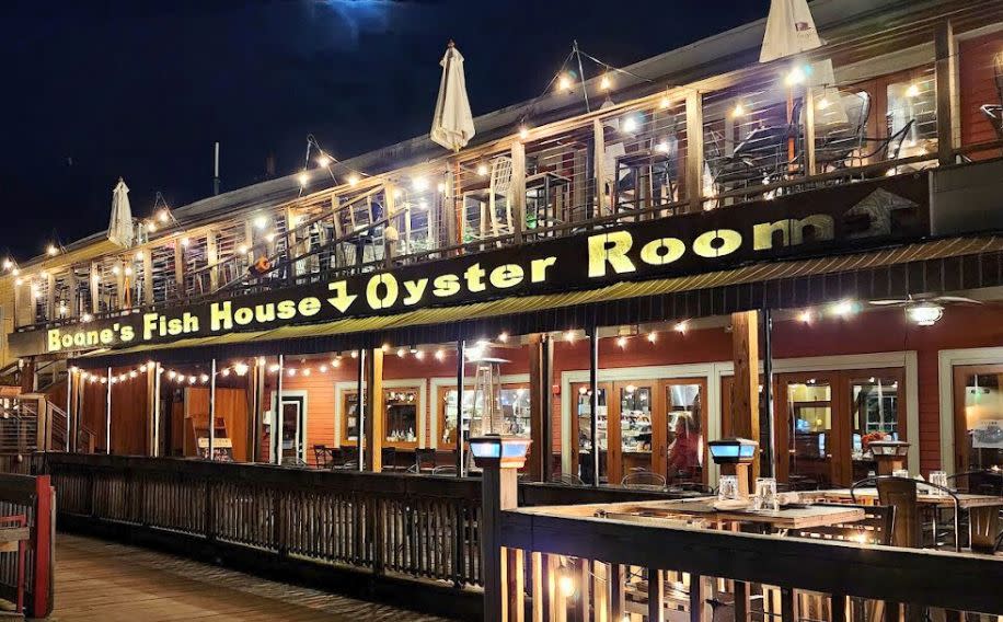 Exterior of Restaurant at Night. Photo Credit: Boone's Fish House & Oyster Room