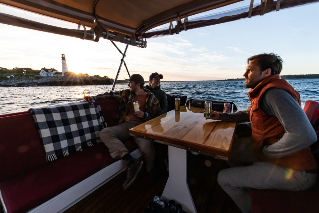 People on Boat by Portland Head Light. Photo Credit: Casco Bay Custom Charters