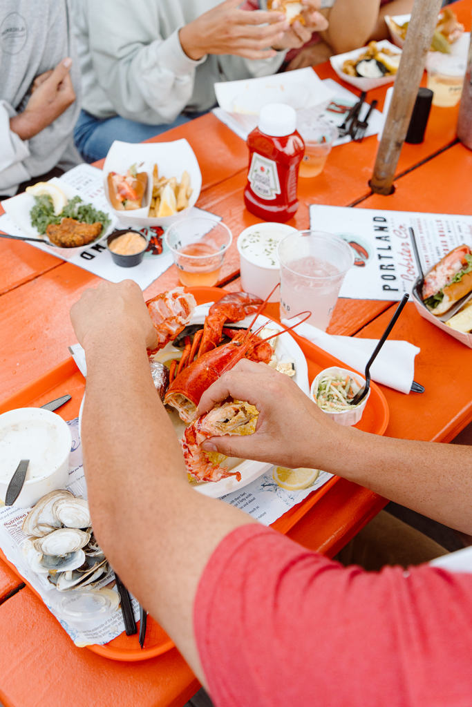 Eating lobster. Photo Credit: Jamie Mercurio Photography