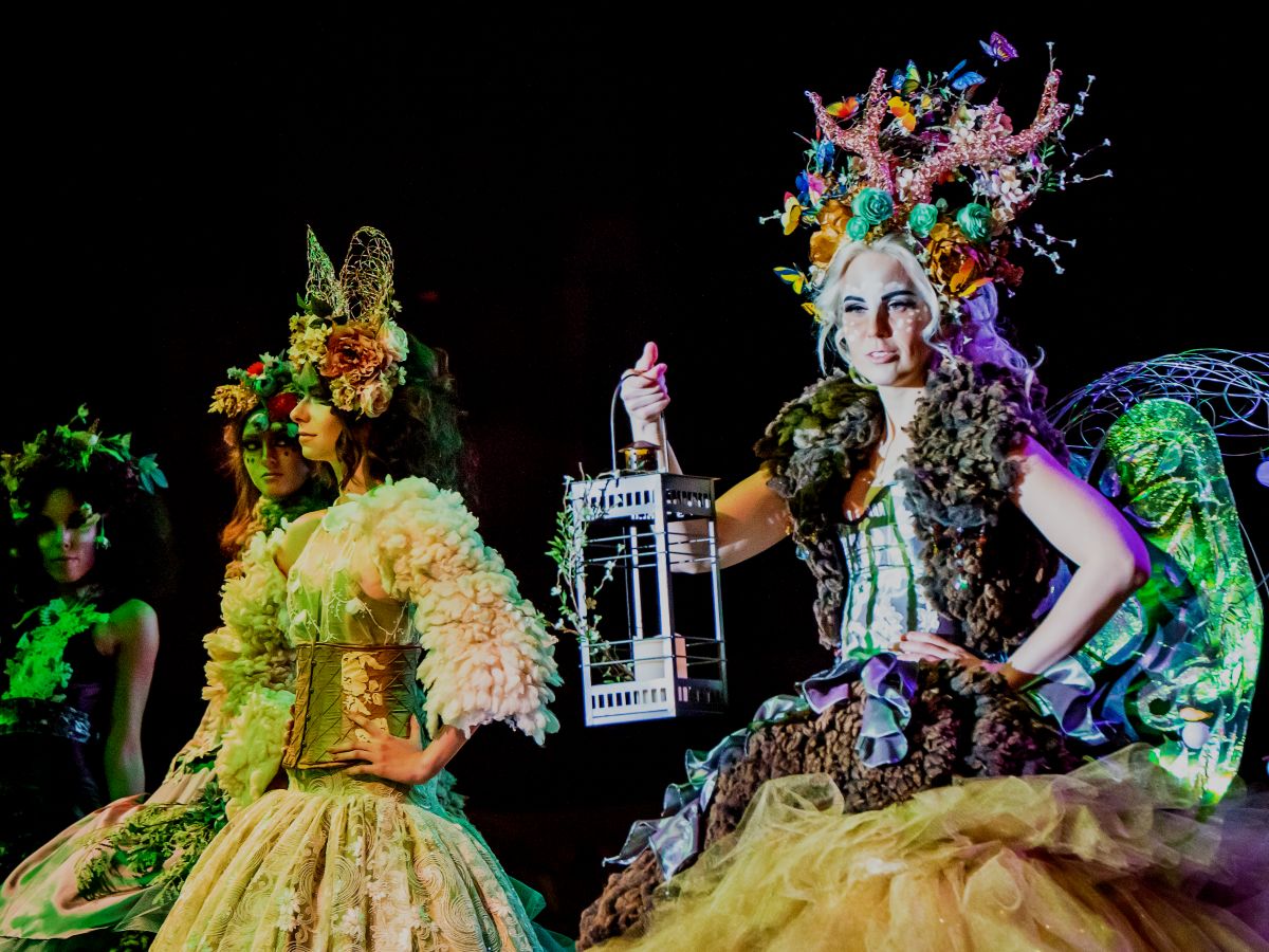 Women wearing extravagant Halloween costumes