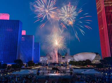 Fireworks in on a dark blue sky at the Empire State Plaza in Albany, New York.