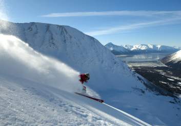 Downhill skier makes tracks on a sunny say at Alyeska Resort in Girdwood.