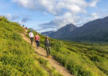 People hike trails in Chugach State Park.