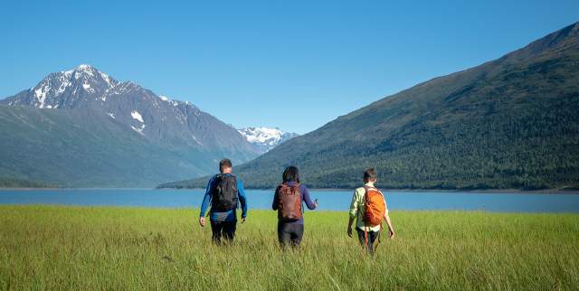 Hikers stroll the lake shore at Eklutna Lake north of Anchorage.