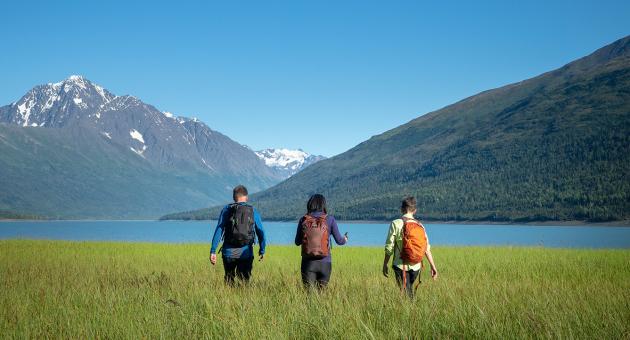 Hikers stroll the lake shore at Eklutna Lake north of Anchorage.