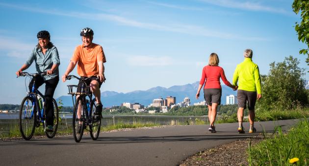 A couple biking on Anchorage's Tony Knowles Coastal Trail