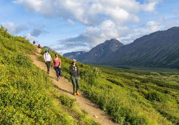 People hike trails in Chugach State Park.