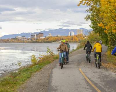 Groups of people enjoying a bike ride on the Tony Knowles Coastal Trail in Anchorage