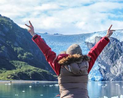 Exploring glacier in Blackstone Bay aboard a day cruise near Whittier, Alaska during summer.