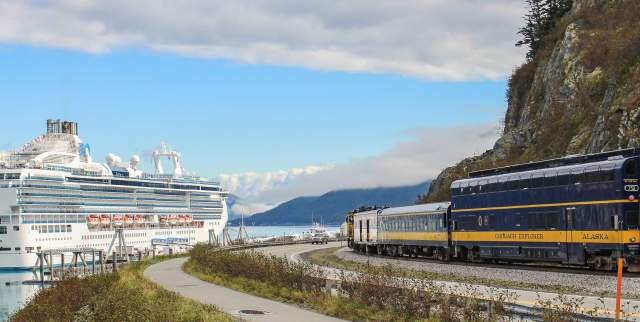 The Alaska Railroad nears a cruise ship in Whittier