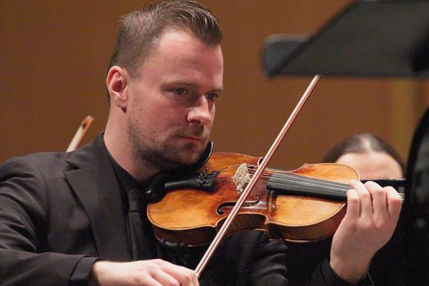 A symphony musician plays the violin at the Alaska Center for the Performing Arts.