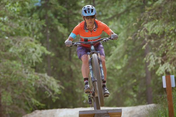 A mountain biker takes a jump on the Hillside in Anchorage.