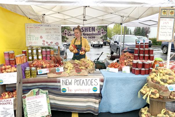 A vendor sells jams, jellies and goods at a south side Anchorage farmers market.