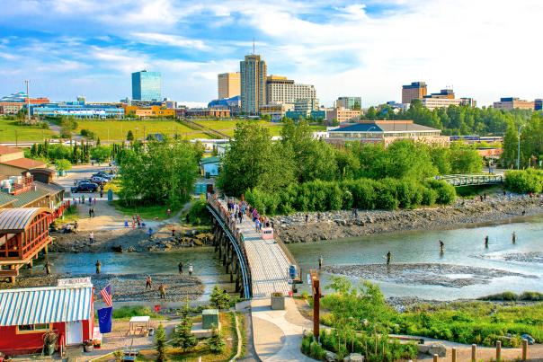 Downtown fishing at Ship Creek with downtown cityscape