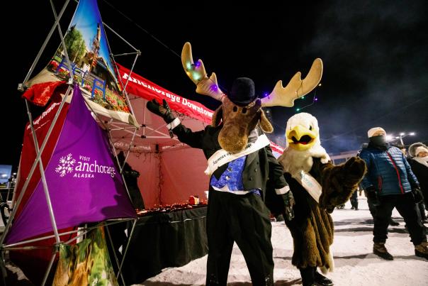 Anchorage's moose mascot Seymour of Anchorage and Egan the eagle appear at a community event on New Year's Eve.