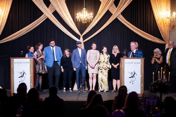 Alaska Tour & Travel staff accept the Seymour Award for Member of the year at the Dena'ina Center on April 18, 2025.