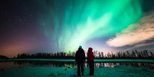 The northern lights, or aurora borealis, add vibrant color to winter nights near Anchorage, Alaska.