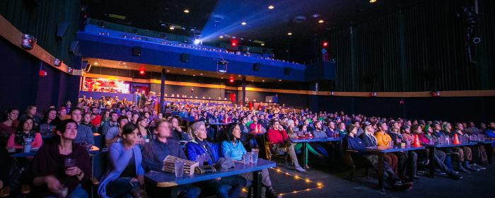 Patrons watch a film at Bear Tooth Theatrepub
