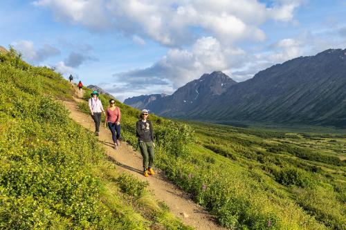 People hike trails in Chugach State Park.
