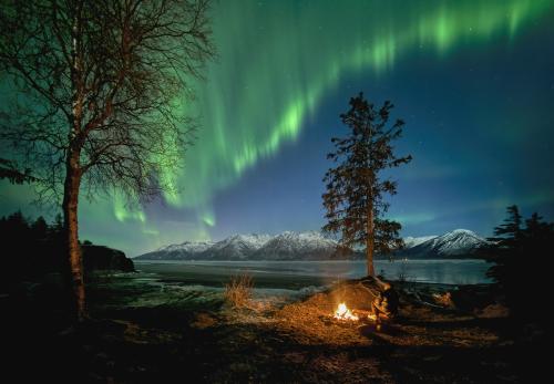 Enjoying a fire while watching the northern lights on Turnagain Arm