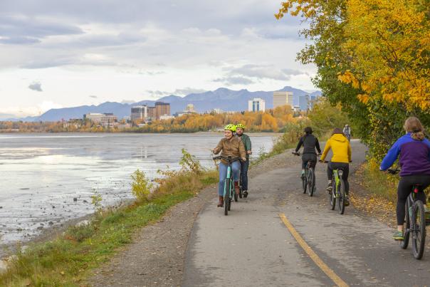 Groups of people enjoying a bike ride on the Tony Knowles Coastal Trail in Anchorage